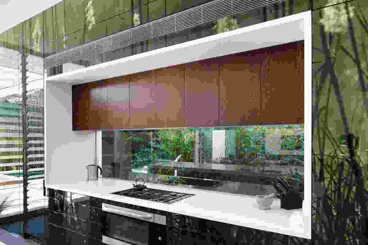 A horizontal window acts as a splashback for the kitchen bench.