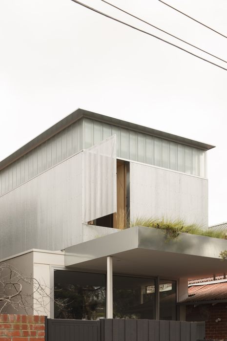 A green roof provides the homeowners with much-needed garden space on a tightly constrained site.