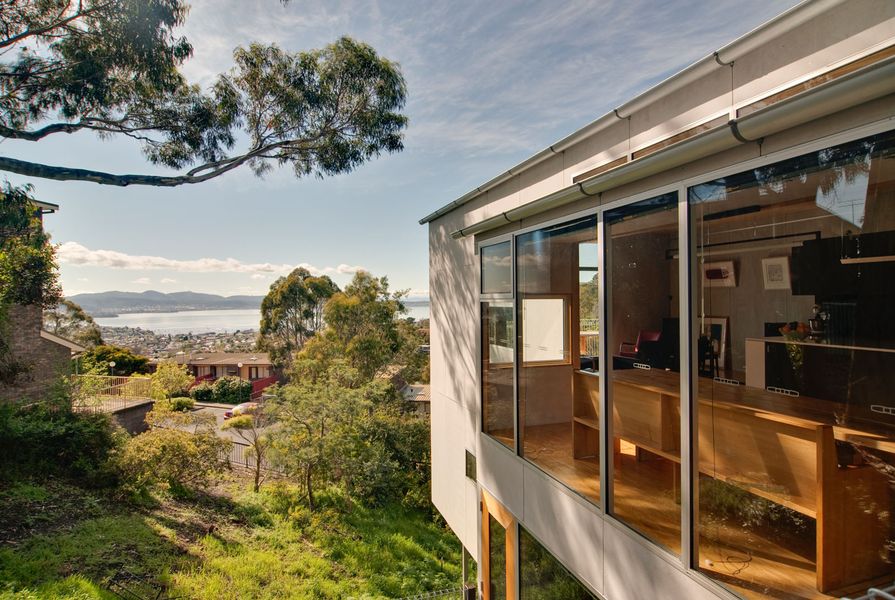 Both houses are oriented toward impressive views of the Derwent River.