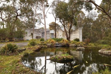 Within the unstructured landscape, the curving limestone walls resonate with gravitas, pinning the house to the site.