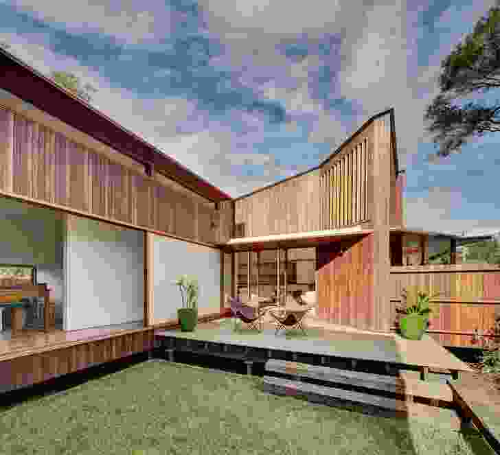 The house is planned around a sunny landscaped courtyard at the front of the site.