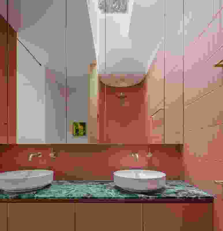 The main bathroom is a visual feast of joyful colour and sculpted forms. Artwork: Bonnie Porter Greene.