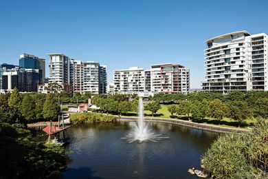 The parkland’s central lake is surrounded by paths and lawn.