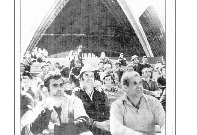 Construction workers in front of the Sydney Opera House.