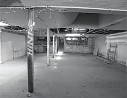 Interior views of condition of showroom prior to restoration.