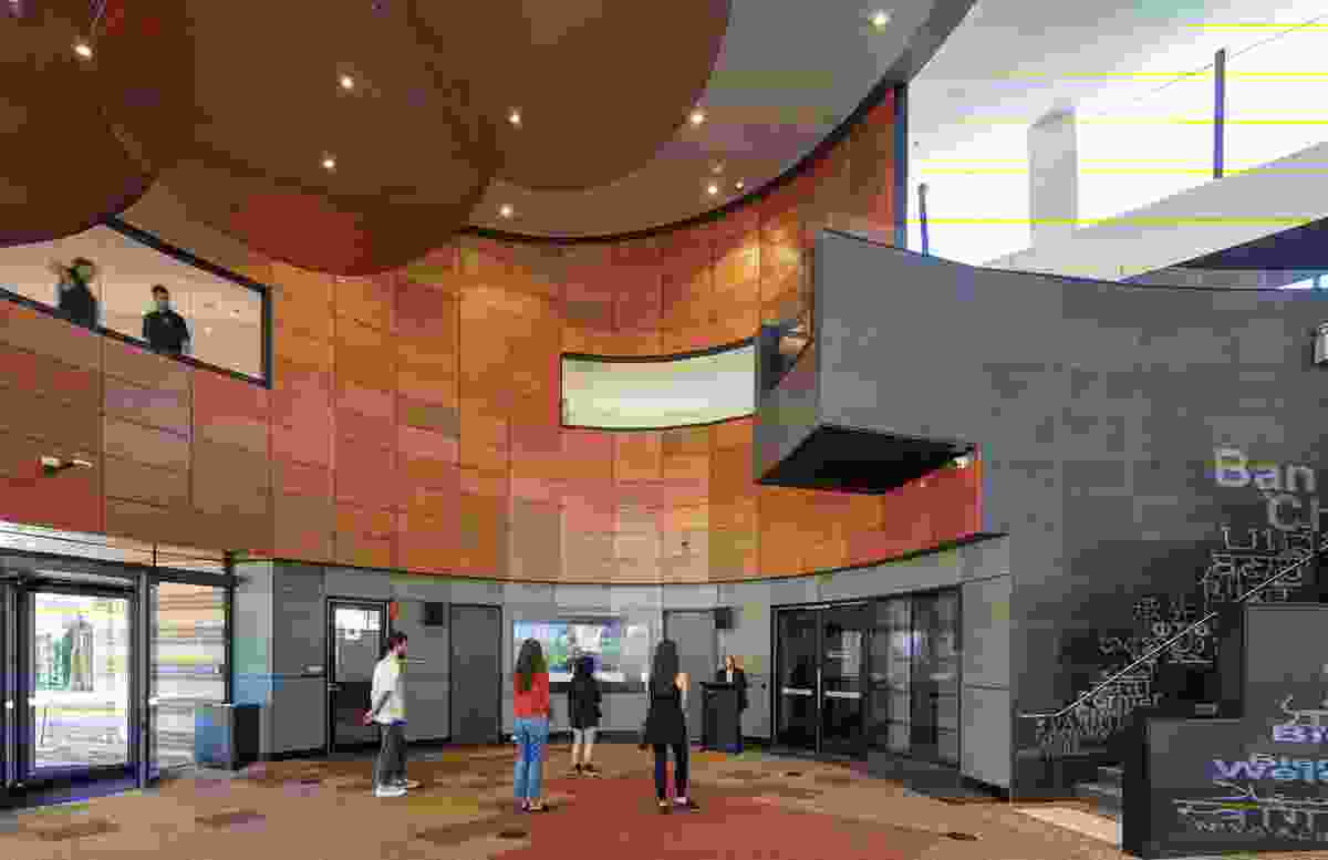 The interior of the customer service hall is inspired by the Enterprise Rose, which grows in the forecourt’s Spirit of Enterprise garden in memory of the Enterprise Migrant Hostel. Artwork: Material Thinking