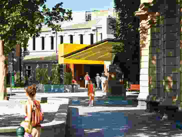 The building’s presence on Lyttleton Terrace is announced by the brightly coloured canopy of the new addition.