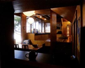 The dining and living areas framed from the kitchen. 