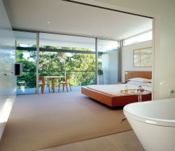 Looking from the ensuite bathroom across the
main bedroom and terrace in one of the upper level
apartments.