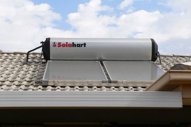 A Solarhart brand solar hot water panel and integrated tank on a house roof in Australia by Fairv8, licensed under  CC BY-SA 3.0