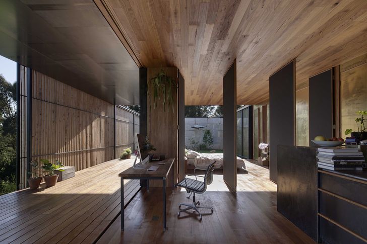 At Sawmill House (2015), walls slide and rotate, enabling a one-bedroom home to expand into the verandah and garden.