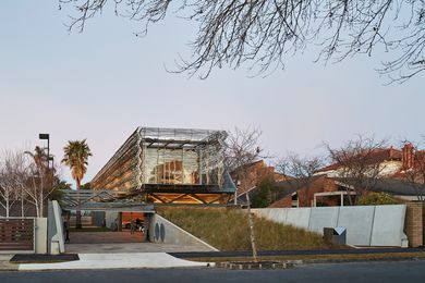 The house reads as a floating pavilion – an open grassed slope climbs to the first floor, fostering a relationship with the street.