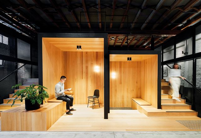 At ground floor, an informal meeting space with timber pods encourages collaboration.