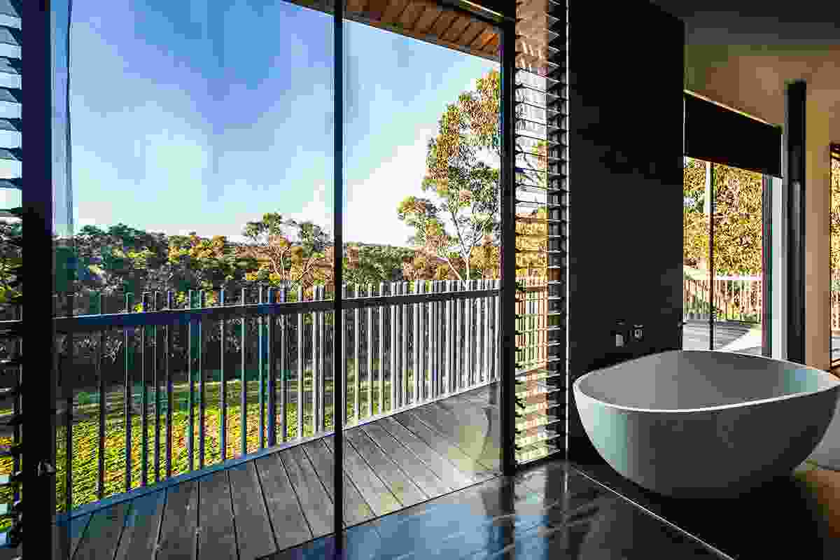 Upstairs bathroom: Viselio Life freestanding bath. Custom balcony balustrade in galvanized steel tubing at irregular intervals.