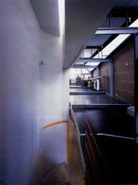 Looking south down the stepped working platforms of the upper-level office space. Photograph Robert Frith.