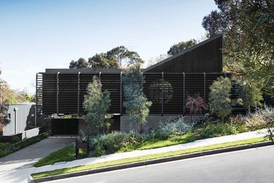 On approach, the home’s bold cantilever and porthole window make for a striking composition in the landscape.