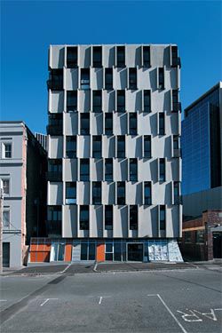 The
Leicester Street facade
is a chequerboard of
wall and window void.