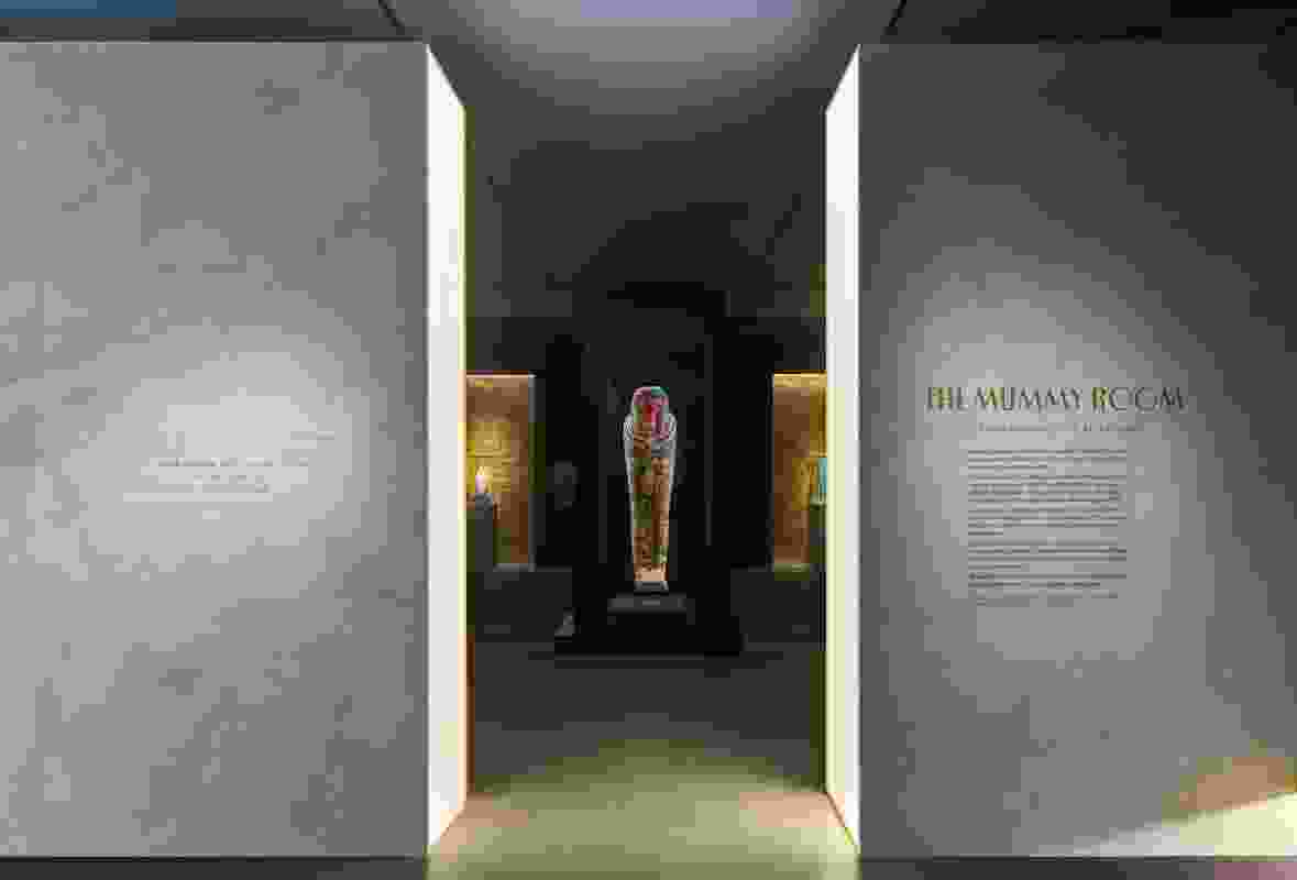 Visitors enter the Mummy Room by crossing a threshold of light, symbolic of the transition to the afterlife.