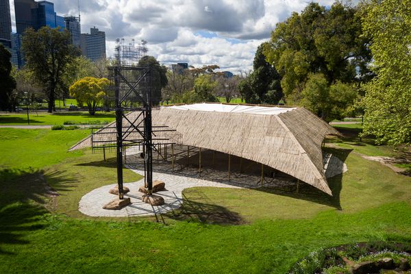 An Indian entrance tower used for ceremonies, called a tazia, provides a welcoming gesture to the MPavilion designed by Studio Mumbai.