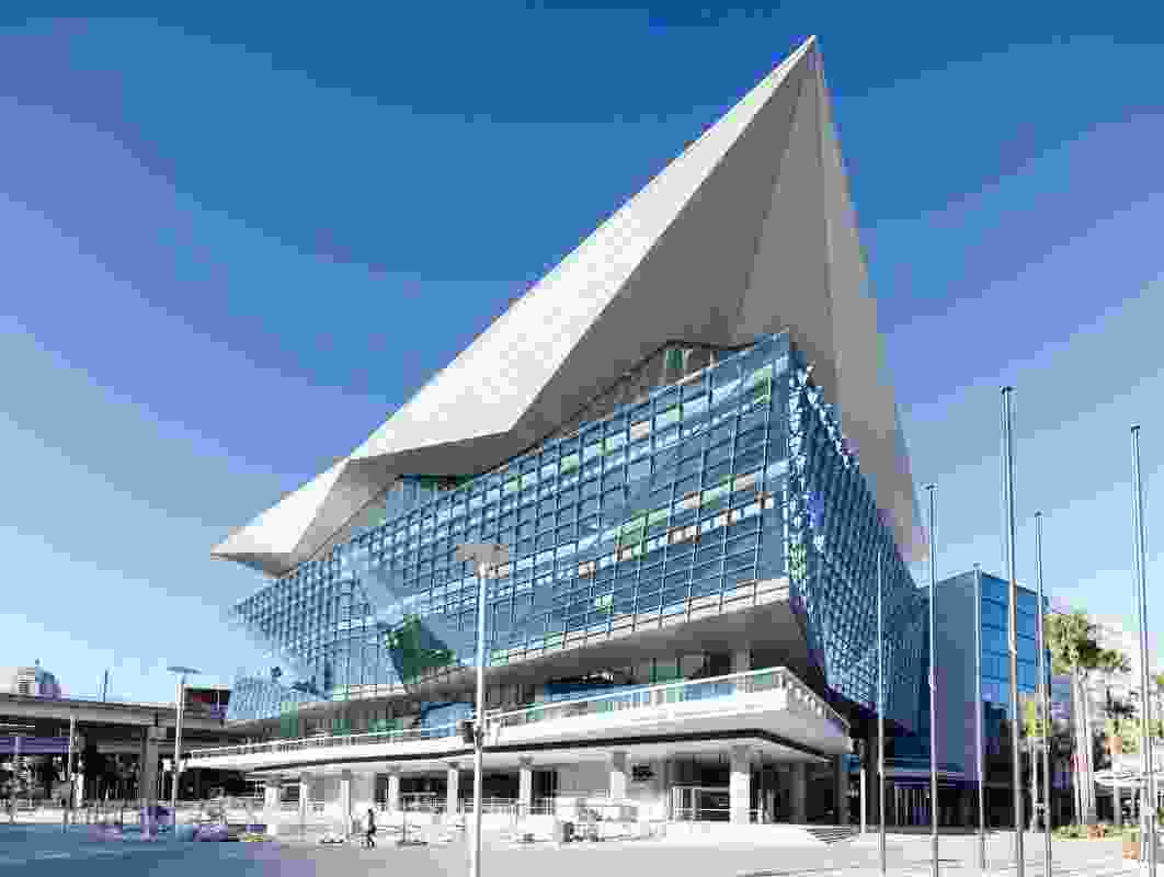 The angular, glazed form of the ICC Sydney Convention Centre is divided from the remainder of the ICC complex by the Western Distributor expressway.