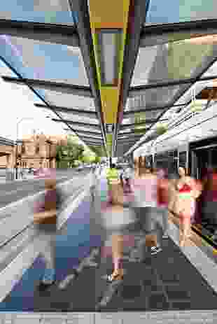 Moving through the city: people alight from a tram at one of central Adelaide’s tram stops. The stops were designed by Peter Elliott Architecture and Urban Design, Dryden Crute Design and TCL.