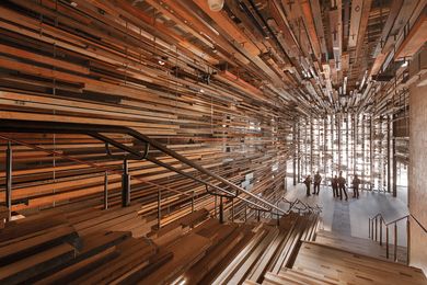 Designed by March Studio, the dramatic entry stair was constructed from more than 2150 pieces of recycled timber.