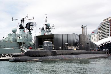 The new pavilion sits between two moored retired naval vessels, the destroyer HMAS Vampire and the submarine HMAS Onslow.