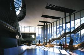 Overview of the glass-encased foyer, with the entry,
reception and box office in the distance.