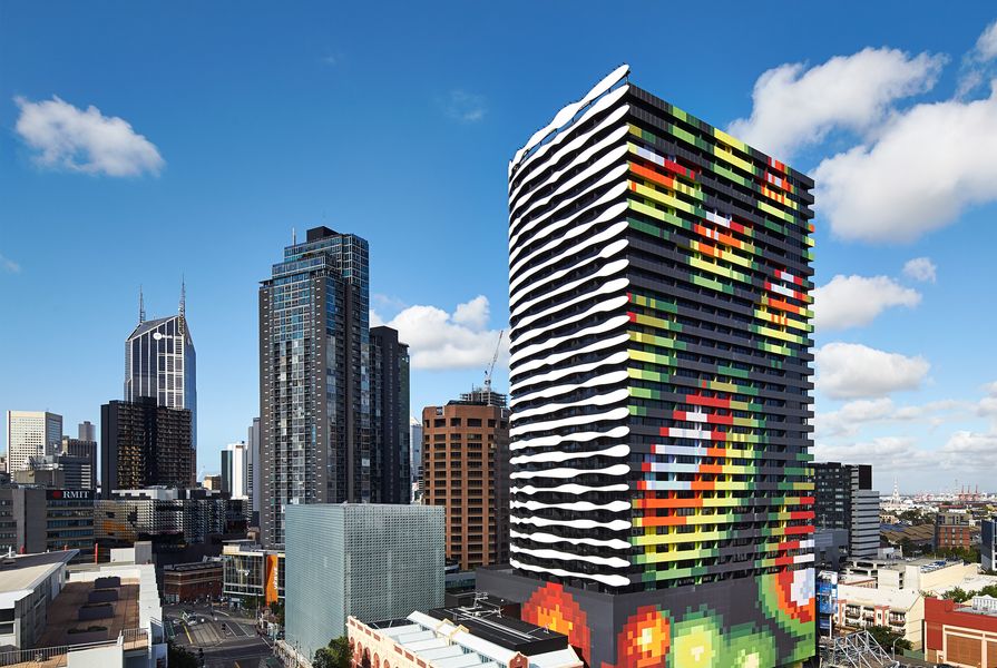 Swanston Square’s eastern and southern facades create the black-and-white image of William Barak while the northern and western facades have a multicoloured pattern reminiscent of a topographic map.