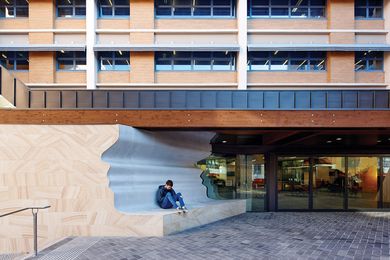 A truss spans over the courtyard, past a stretched formation of Beethoven’s face.