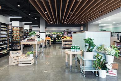 Mint-green tiles and oak timber give customers a fresh space to shop.