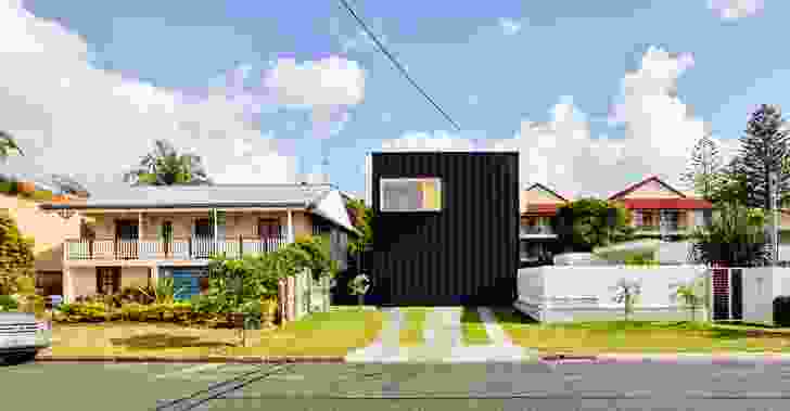 The facade of Francis Street House is clad in compressed fibre cement sheeting overlaid with vertical battens to create shadow and texture .