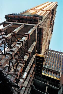 The hotel tower hovering on its brick pillars while the podium was demolished and rebuilt. Image: Annabel Moeller.