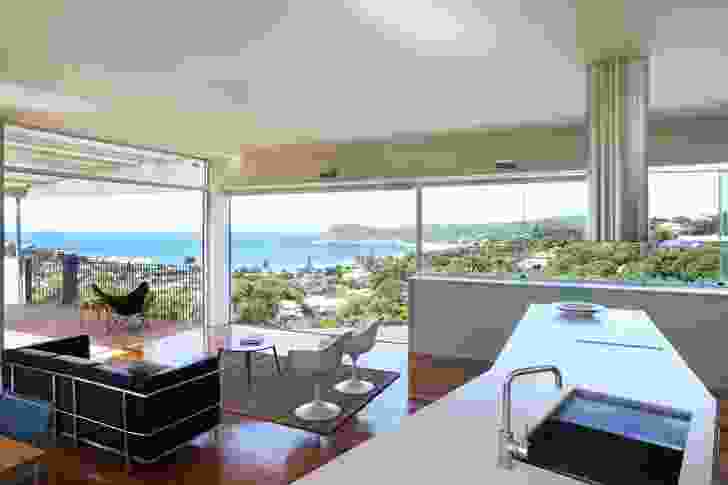 The upstairs living space tilted south to the ocean view; low interior walls screen from neighbours.  