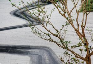 Yueyuan Courtyard by Z+T Studio explores the concept of erosion through the design of an intricate granite watercourse that flows through the space.