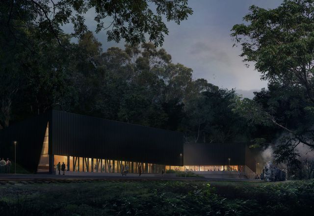 The Lakeside Discovery Centre by Terroir has a deep black exterior, echoing the locomotives of the railway and allowing the large building to recede into the shadows of the bush.