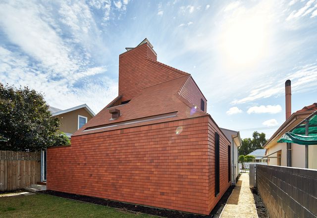 Designed in the manner of an oast, the extension is a reference to the industrious local migrant community.