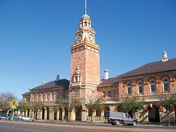 The site of the Kalgoorlie Courts Project, the 100-year-old Warden’s Court and Post Office Building. These are part of the Government Buildings complex, which included the Post and Telegraph Office and Public Buildings. Designed by the Public Works Department under the direction of its principal architect, John Harry Grainger, the Government Buildings were built in local pink stone, and completed in 1897. Photograph Geoffrey London.