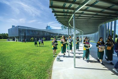 The new science building at Trinity Anglican School is a concrete and single masonry block structure wrapped in a sunscreen of prefabricated steel channels.
