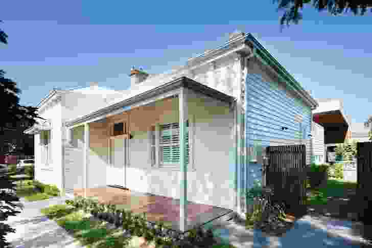 A spotted-gum-lined roof overhang cradles the existing dwelling.