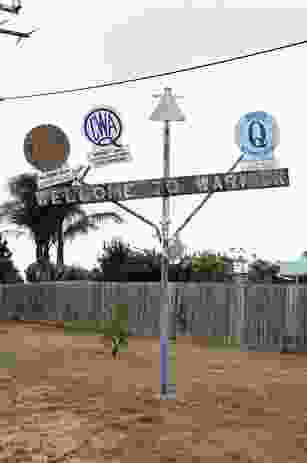 In Warwick, Queensland, a rickety crucifix sprouts the shields of the town’s service clubs: Rotary, the Country Women’s Association, Lions, Apex, Quota International.