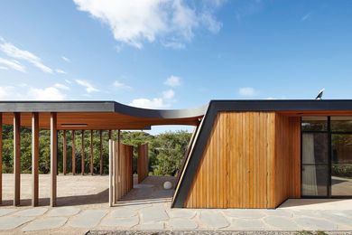 The house exterior is clad in radial-sawn boards, which will change colour and texture as the building ages.