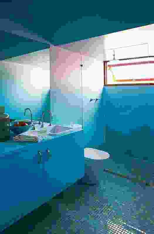 A playful blue bathroom on the upper level provides some joy in a usually mundane room.