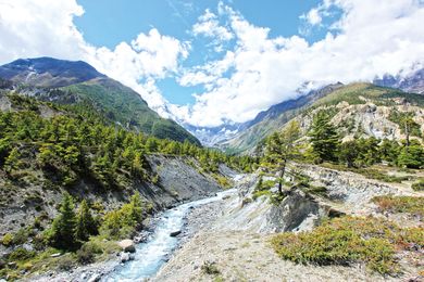The Marsyangdi River between the village of Pisang and the town Manang, with the mountain peak Annapurna III in the background.