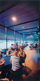  The outdoor cafe space sheltered by the pavilion roof and shaded by holland blinds. 