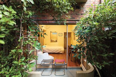 The connection between the small space and the existing courtyard is reinforced through subtle design interventions.