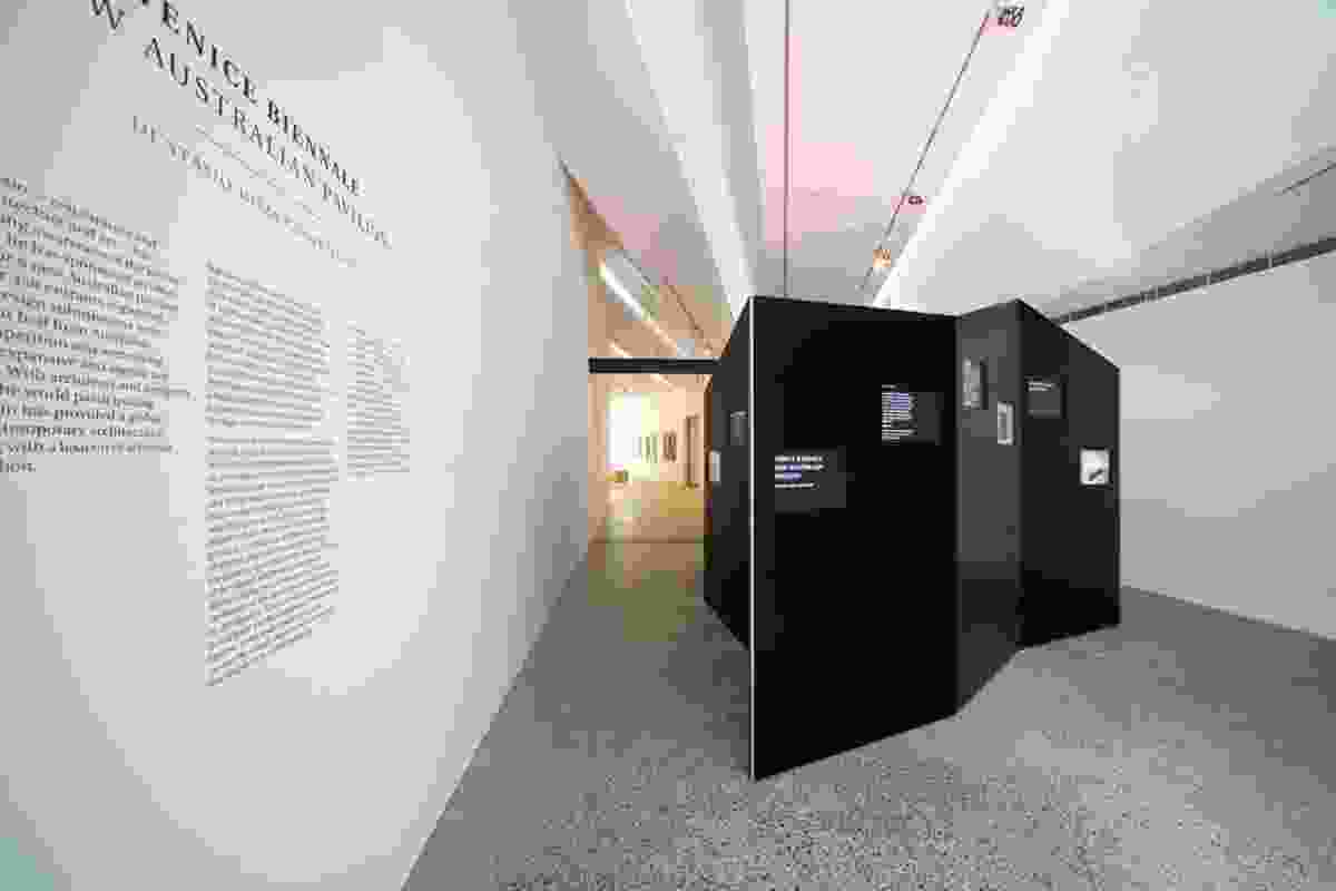 The black, folded, continuous wall within which the entries are digitally displayed.