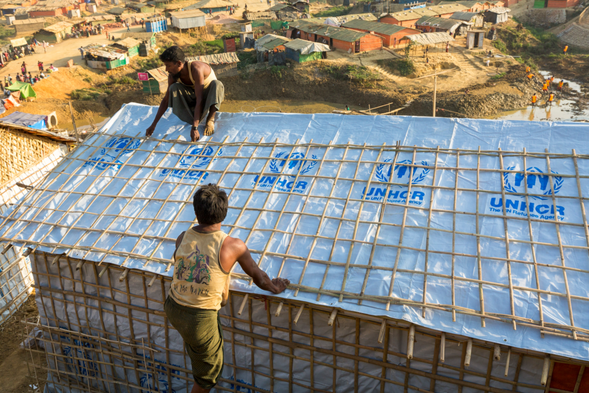 Rohingya refugees constructing housing in Bangladesh. 