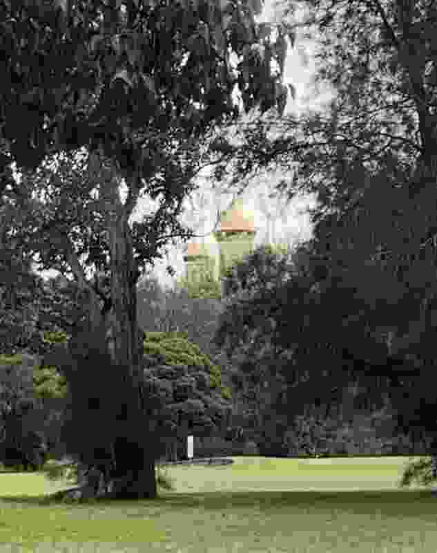A view from a fairway at Northcote Golf Course draws the viewer's gaze beyond the immediate greens to a Russian Orthodox church in the distance.