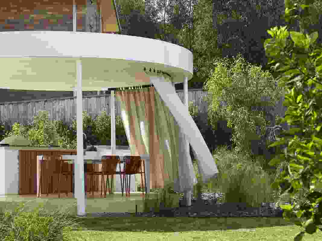 The curtain animates the rotunda and can be easily adjusted to manage privacy and sun.